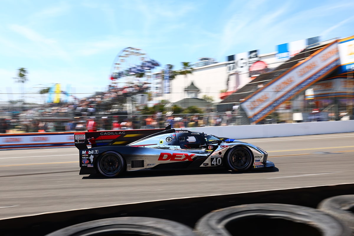 Side View of the Silver Cadillac V-Series.R Race Car Speeding on the Race Track
