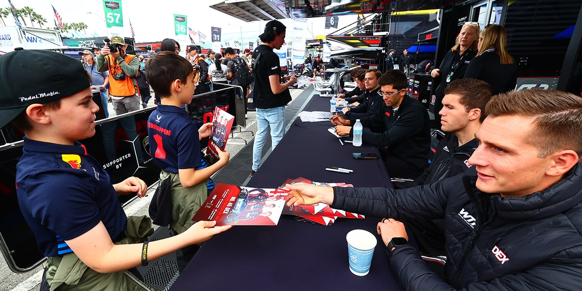The Cadillac Racing Team Signing Autographs for Young Fans