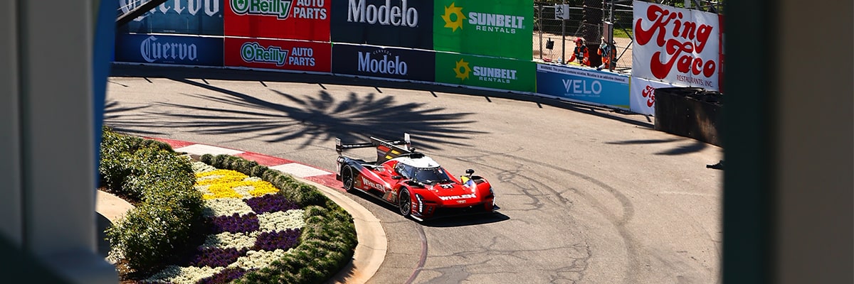 Bird's Eye View of the Red Cadillac V-Series.R Race Car Driving on the Track