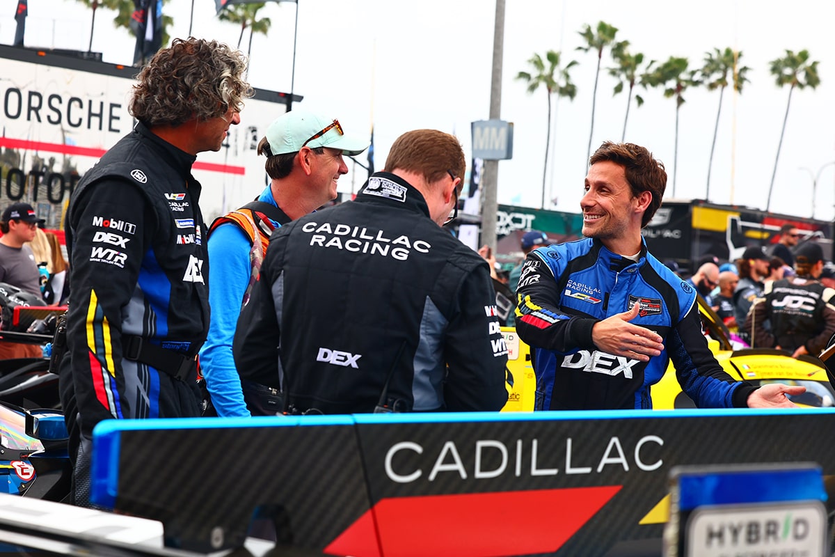 Close-up of the Cadillac Racing Team Members and Drivers Smiling and Talking on the Track
