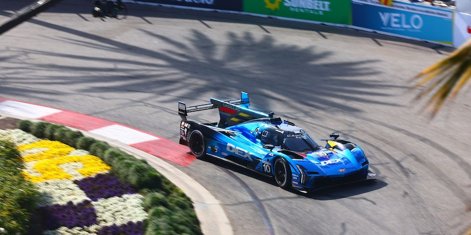Bird's Eye View of the Blue Cadillac V-Series.R Race Car Driving on the Track