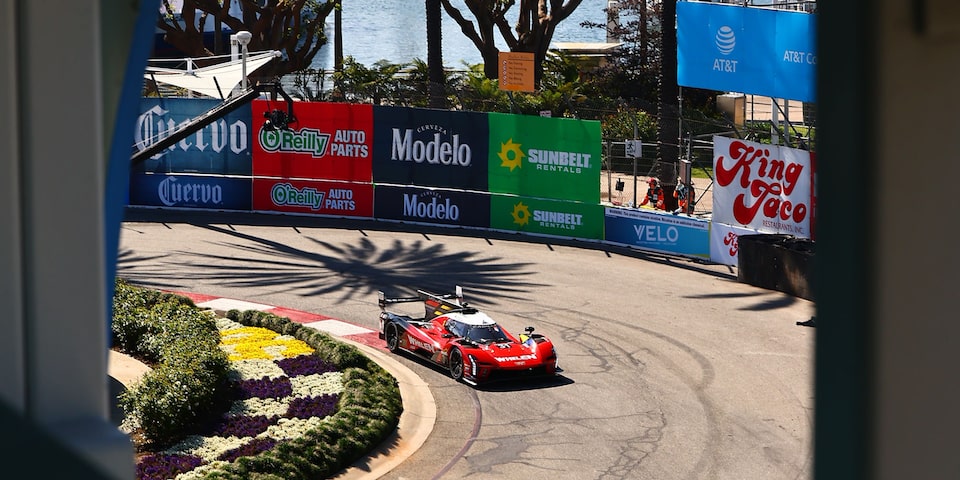 Bird's Eye View of the Red Cadillac V-Series.R Race Car Driving on the Track