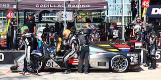 Close-up of the V-Series Cadillac Racing Logo on the Red Racecar