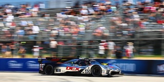 Front View of the V-Series.R Racecar Driving Down on a Track