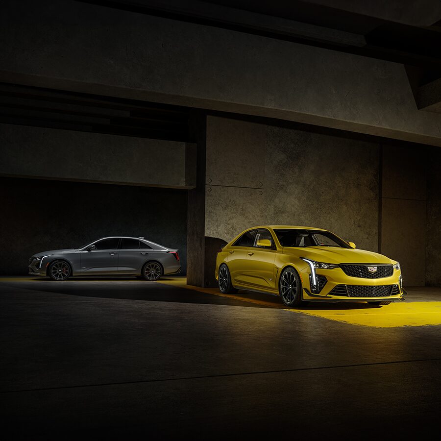 Two 2024 Cadillac CT4-Vs Parked in a Parking Garage