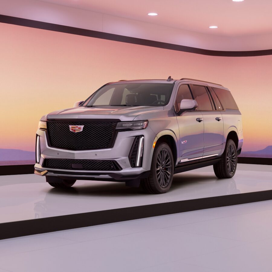 2023 Cadillac Escalade V Parked on Sand With Mountains Protruding in The Background