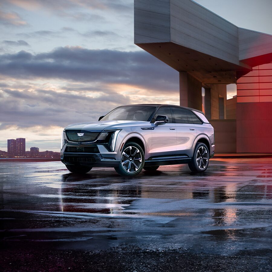 2025 Cadillac ESCALADE IQ Parked Under an Overpass Bridge During a Cloudy Day