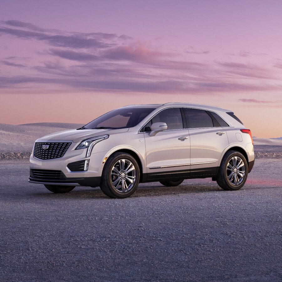 2024 Cadillac XT5 Parked Off-Road at Dusk With Mountains in The Background
