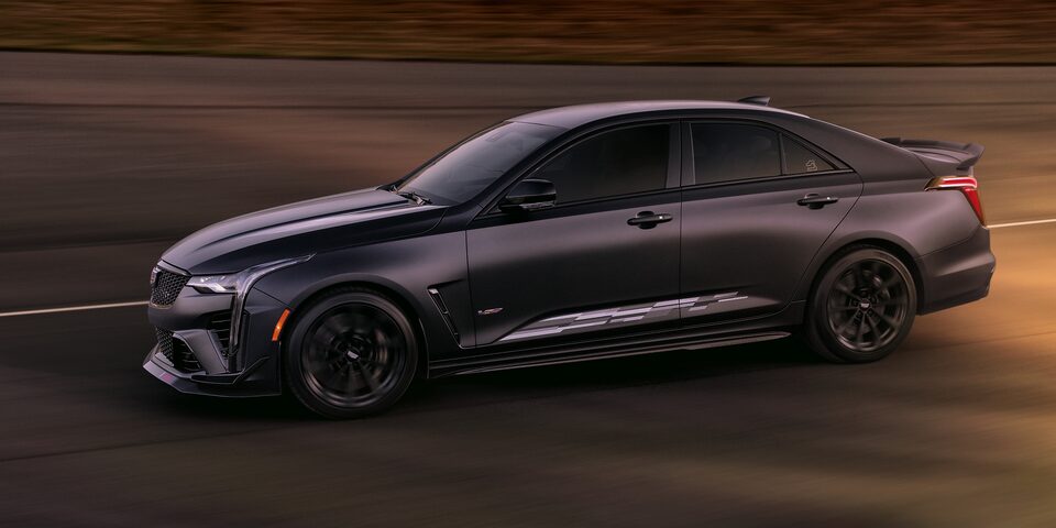 The Sebring IMSA Maverick Noir Frost Cadillac CT4 Blackwing Driving Quickly on the Track