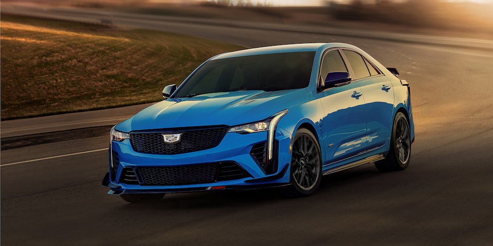 The Electric Blue Cadillac CT4 Blackwing Hitting a Sharp Corner on the Track