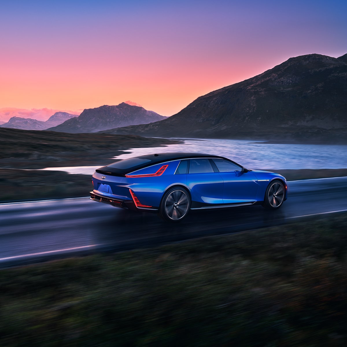 The Cadillac CELESTIQ Cruising on a Lakeside Mountain Road During a Beautiful Sunset
