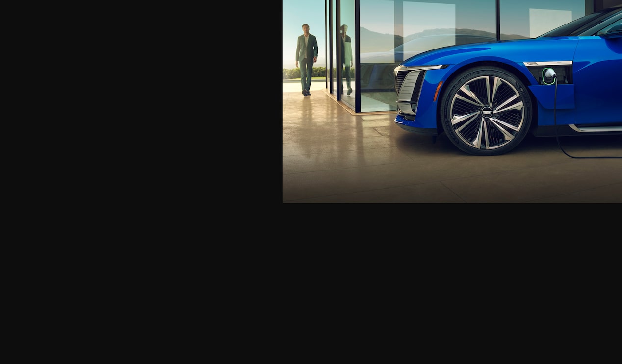 A Man Approaches His Cadillac CELESTIQ As it Charges in his Luxurious Home