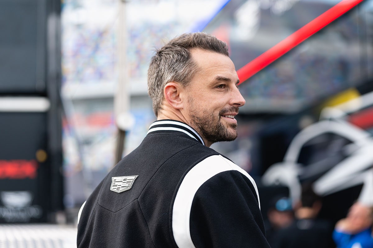 Close-up of a Cadillac Racing Team Member Looking into the Distance Wearing a V-Series Hoodie
