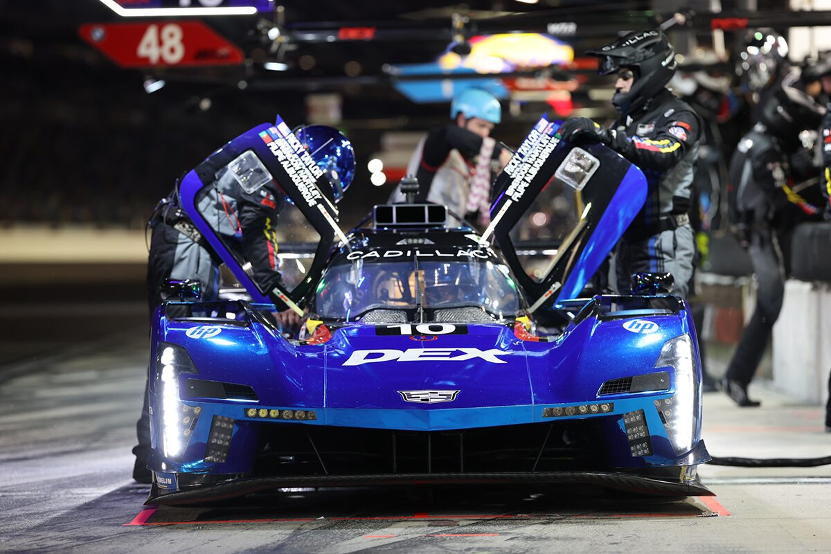 The Red V-Series.R Racecar Being Worked on at the Track's Pit Stop