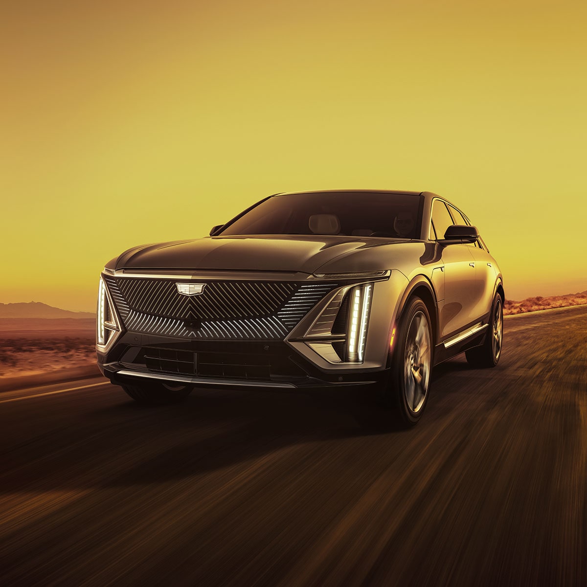 The Cadillac LYRIQ Parked in a Garage while Charging with a Gorgeous Sunset Backdrop