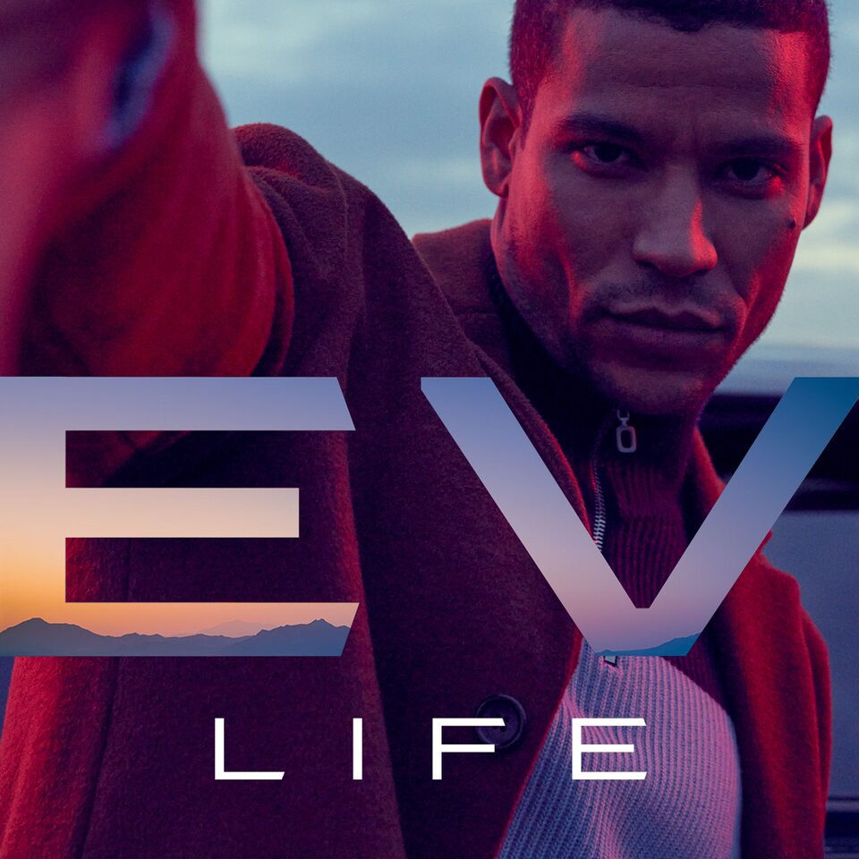 A Man Posing with "EV Life" Text Displayed