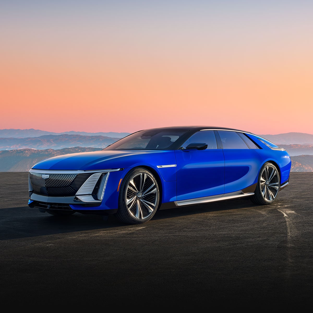 Three-quarter View of a Blue Ultra-luxury Cadillac CELESTIQ Parked Under a Mountain Sunset