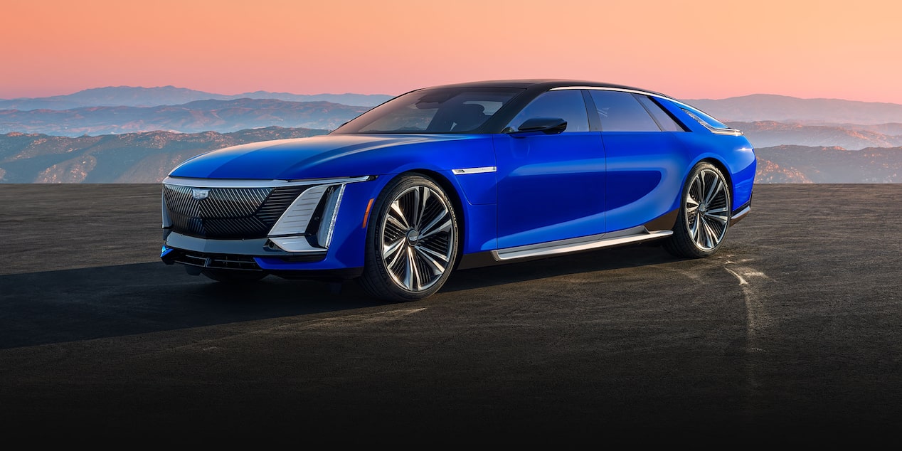 Three-quarter View of a Blue Ultra-luxury Cadillac CELESTIQ Parked Under a Mountain Sunset